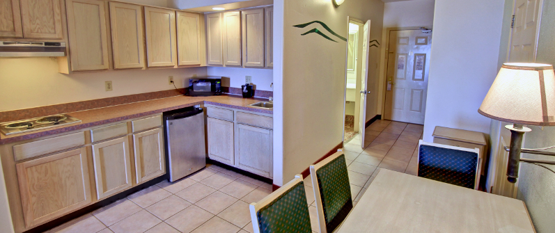 Kitchen and Bedroom at South Padre Island Four Queen Family Suite